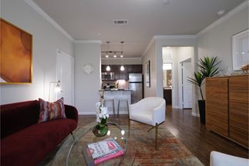 spacious open-concept apartment with hardwood-inspired flooring at Park at Magnolia apartments